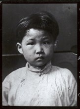 Child freed from 'mui tsai'. Portrait of a child slave, freed from domestic servitude under the