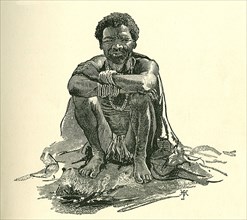 Portrait of a Sudanese slave. Illustration of a Sudanese slave, squatting on the ground beside by a
