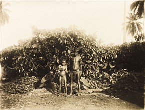 Inhabitants of Bioko. Portrait of a semi-naked man and boy, inhabitants of the island of Bioko. The