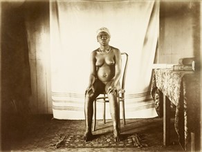 Young woman from Bioko. Portrait of a young woman from Bioko. Posed seated against a makeshift