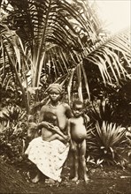 Inhabitants of Bioko. Portrait of a woman from Bioko with her two young children. Bioko, Equatorial