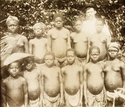 Girls from Bioko. A group of semi-naked girls from Bioko line up for the camera. Bioko, Equatorial