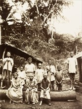 Villagers of Bioko. A group of men, women and children from Bioko line up for the camera in a rural