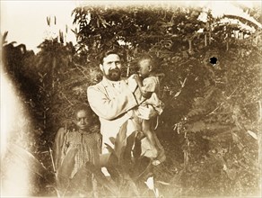 A British missionary on Bioko. Portrait of a British Primitive Methodist missionary with two young