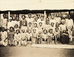 Inhabitants of Bioko. A group of men, women and children from Bioko line up for the camera. Bioko,