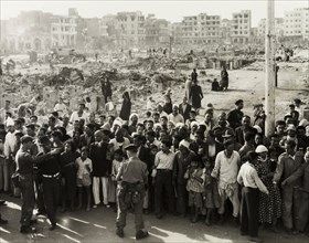 Hungry crowds during the Suez Crisis. British troops control crowds of hungry civilians in the days