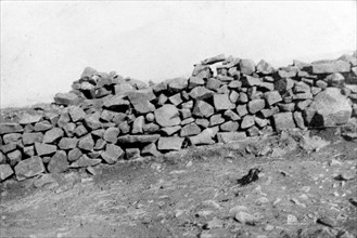 Boer defenses at Pieters Hill. A roughly built stone wall forms part of a Boer defense line, used