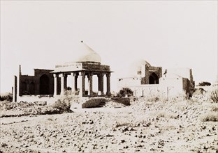 Makli Hills necropolis. A pillared tomb with a domed canopy roof at Makli Hills necropolis. Makli