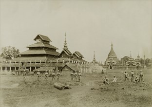 Wuntho Palace and the 'Pon-gyi kyaung'. British Army soldiers pose in front of Wuntho Palace (left)