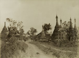 The road into Youngma. The road leading into Youngma, lined with carved stone 'zeidis' or pagodas.