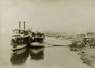 Ferries on the Irrawaddy River. Two ferries containing soldiers from the Second Mountain Battery of