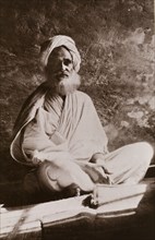 Portrait of Osman Digna. Portrait of Osman Digna (c.1836-1900), sitting cross-legged on a mat,