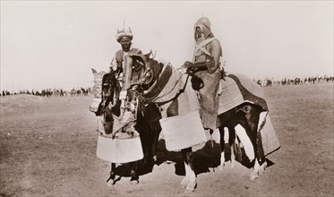 Sudanese warriors on horseback. Portrait of two Sudanese warriors on horseback, positioned in front