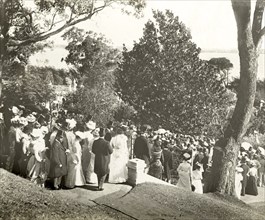 New Year's garden party at Government House, Perth. Crowds of formally dressed guests descend steps