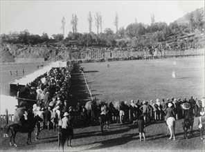 Spectators at a Durand Cup football match. An audience of mainly British spectators crowds the