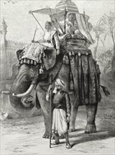An Indian nobleman rides a decorated elephant. An illustration from the 'The British Workman'