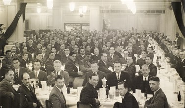 Colonial Police Force dinner, 1954. A large group of British men attend a formal dinner and award