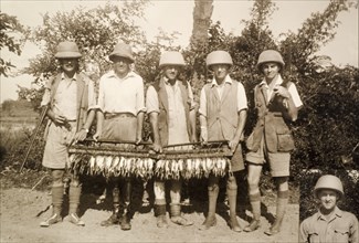 Trophies from a snipe hunt. Five British hunters stand side-by-side, displaying the trophies of a