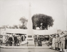 Unveiling a war memorial at the Residency Bazaar. A crowd attends the official unveiling of a war