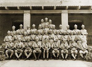 Jhelum Police, 1938. Uniformed ranking officers of the Jhelum Police pose for a group portrait to