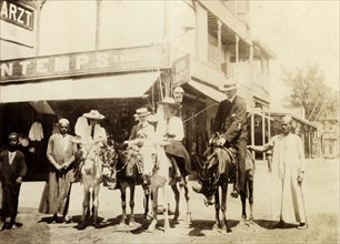 The Lawley children ride donkeys at Port Said. The Lawley children, left to right: Cecilia, 'Ned'