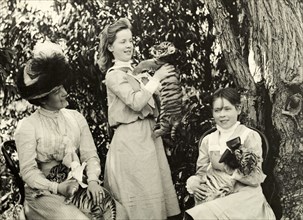Playing with tiger cubs at Perth Zoo. Annie Lawley and her daughters, Ursula (middle) and Cecilia