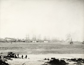 Steam ships in harbour at Fremantle. Steam-assisted sailing ships and steamships sit in the harbour