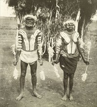 Aborigines in ceremonial costume. Portrait of two middle-aged aborigines, dressed in ceremonial