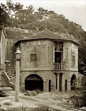 A Chinese Joss house in Hong Kong. A large apse, supported by arches, projects from the rear of a