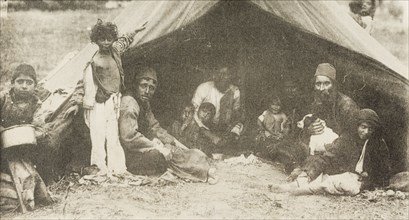 A family of Egyptian nomads. A family of Egyptian nomads, possibly bedouins, gaze at the camera