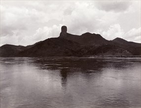 Monk's Head Rock' across the Xijiang River. View across the Xijiang River, featuring an unusual