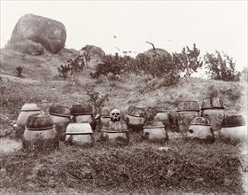 Chinese burial urns. A number of burial urns, containing exhumed human bones, are grouped together
