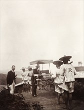 Two doctors with a sedan chair. Two British doctors, Dr Rennie (left) and Dr Marriott (right),