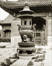 Incense burner at a Buddhist temple in China. A large, ornamental incense burner stands in the