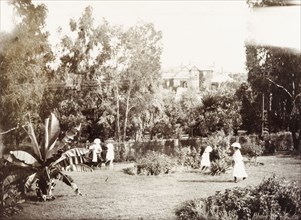 Children play in grounds of the Governor's residence. Cecilia and Ursula Lawley, the daughters of
