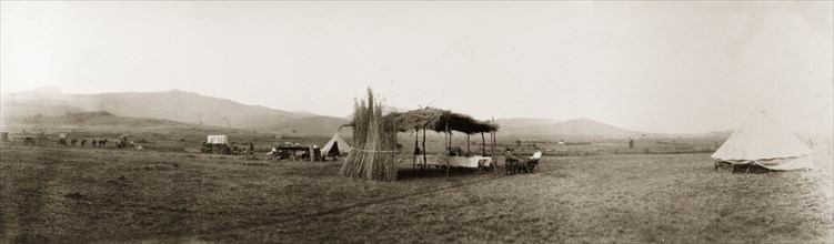 Camp site near Louis Trichardt. A makeshift thatched canopy stands in the centre of a camp site