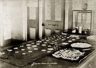 A ?60,000 parcel of diamonds'. A long table is covered with parcels of diamonds at the De Beers