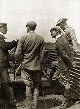 Robert Baden-Powell travelling in armoured train. Captain J.S. Nicholson (left) and Robert