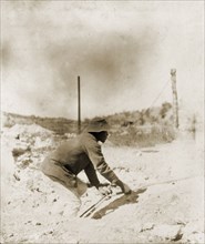 A labourer at the Kimberley diamond mines. An African labourer hauls a rope at the De Beers diamond