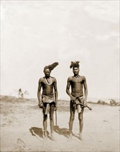 Portrait of two Matabele indunas. Portrait of two Matabele (Ndebele) indunas (chiefs), semi-naked