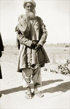 An elderly Afridi man. Full-length portrait of an elderly Afridi man, dressed in traditional