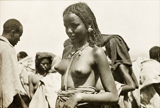 A young Eritrean woman. Portrait of a young Eritrean woman, taken at an outdoor camel market. Naked