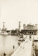 The Harimandir Sahib at Amritsar. A walkway leads over a pool to the Harimandir Sahib, or Golden