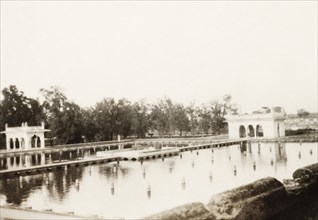 The Shalimar Gardens in Lahore. View across a rectangular marble pool and Mughal-style summer