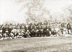 A garden party at Mianwali. Group portrait of a number of Indian officials, accompanied by eight