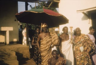 The Adontenhene of Akuapem. The Adontenhene of Akuapem, Nana Osae Djan II, stands beneath a