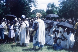 Zongo musicians at a Ngmayem festival. Crowds at an annual Ngmayem harvest festival are entertained