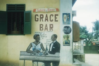Advertisement for beer, Ghana. An advertisement painted on the exterior wall of a bar or shop