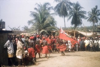 Flag dance of Asafo Number Two Company. A 'frankakitanyi' (flag dancer) swings the flag at the