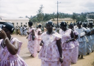 Women dancing in Easter parade. Ghanaian women dance in procession during an Easter parade.